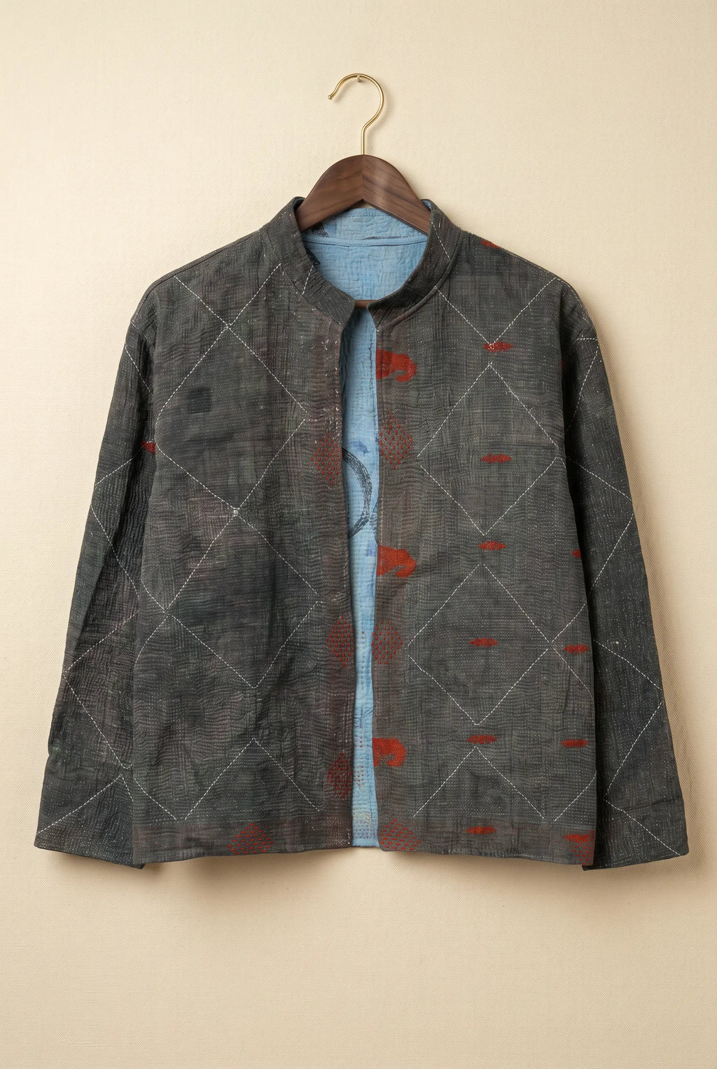 Pratima Indigo jacket — dark grey reverse side with diamond kantha stitching on hanger