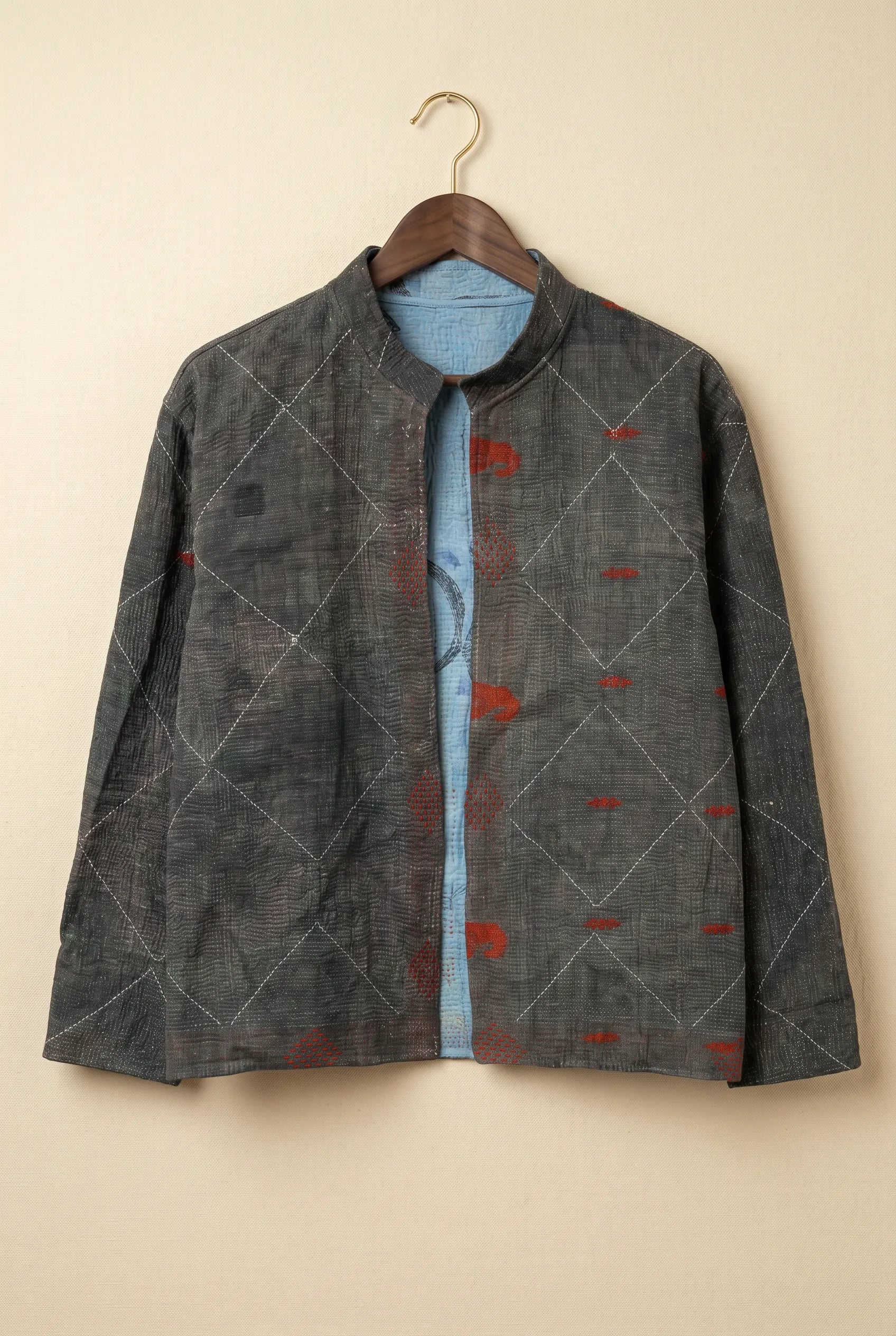 Pratima Indigo jacket — dark grey reverse side with diamond kantha stitching on hanger