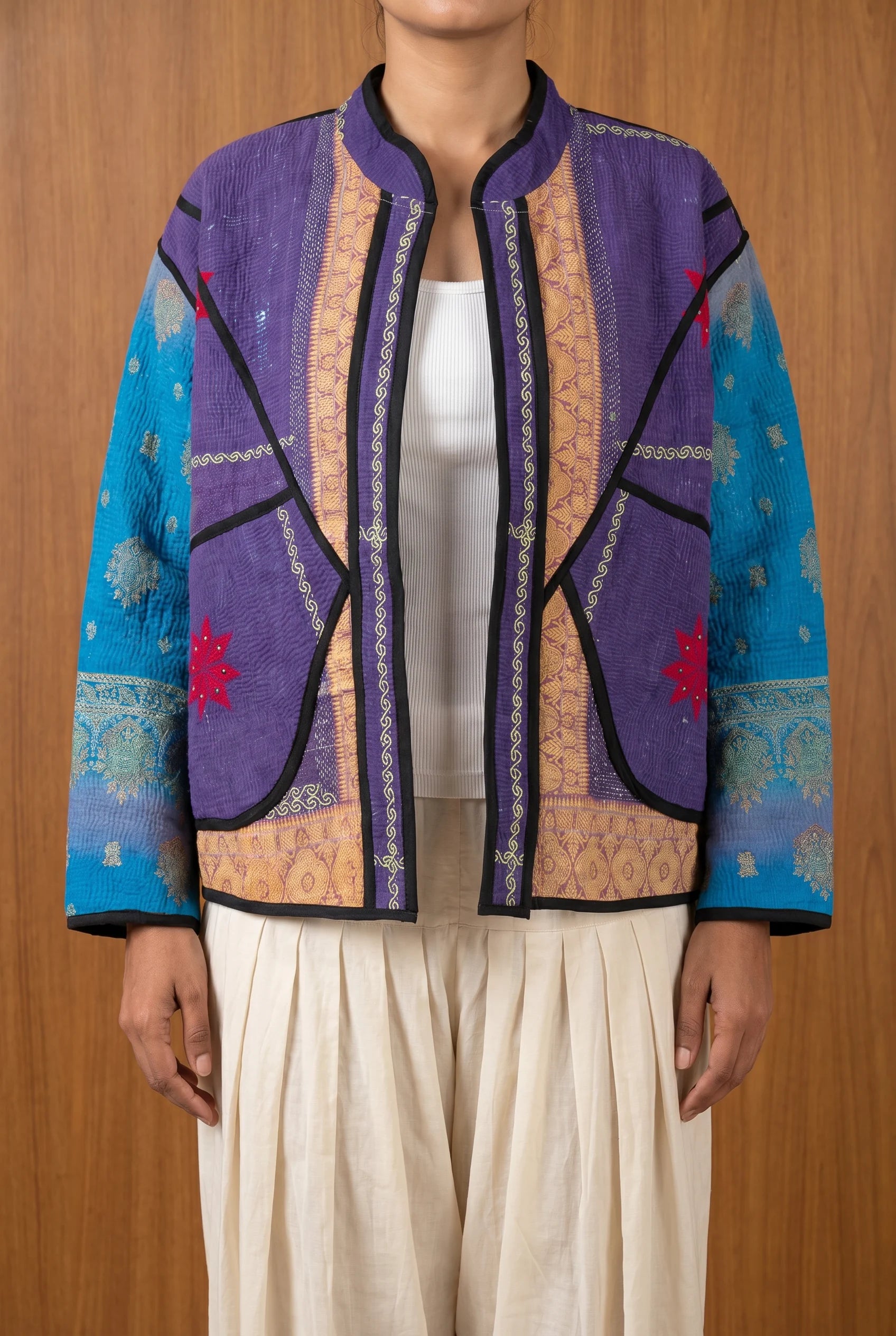 Model wearing Bijji reversible kantha jacket open, hand-embroidered upcycled Indian outerwear