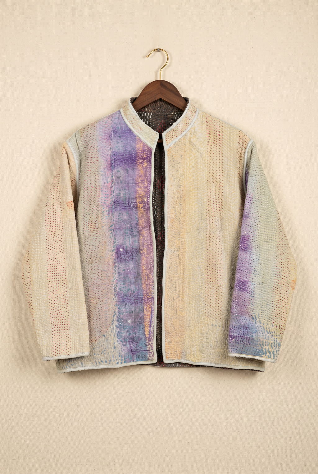 Pratima reversible kantha jacket — reverse side in natural cream with indigo panel on hanger