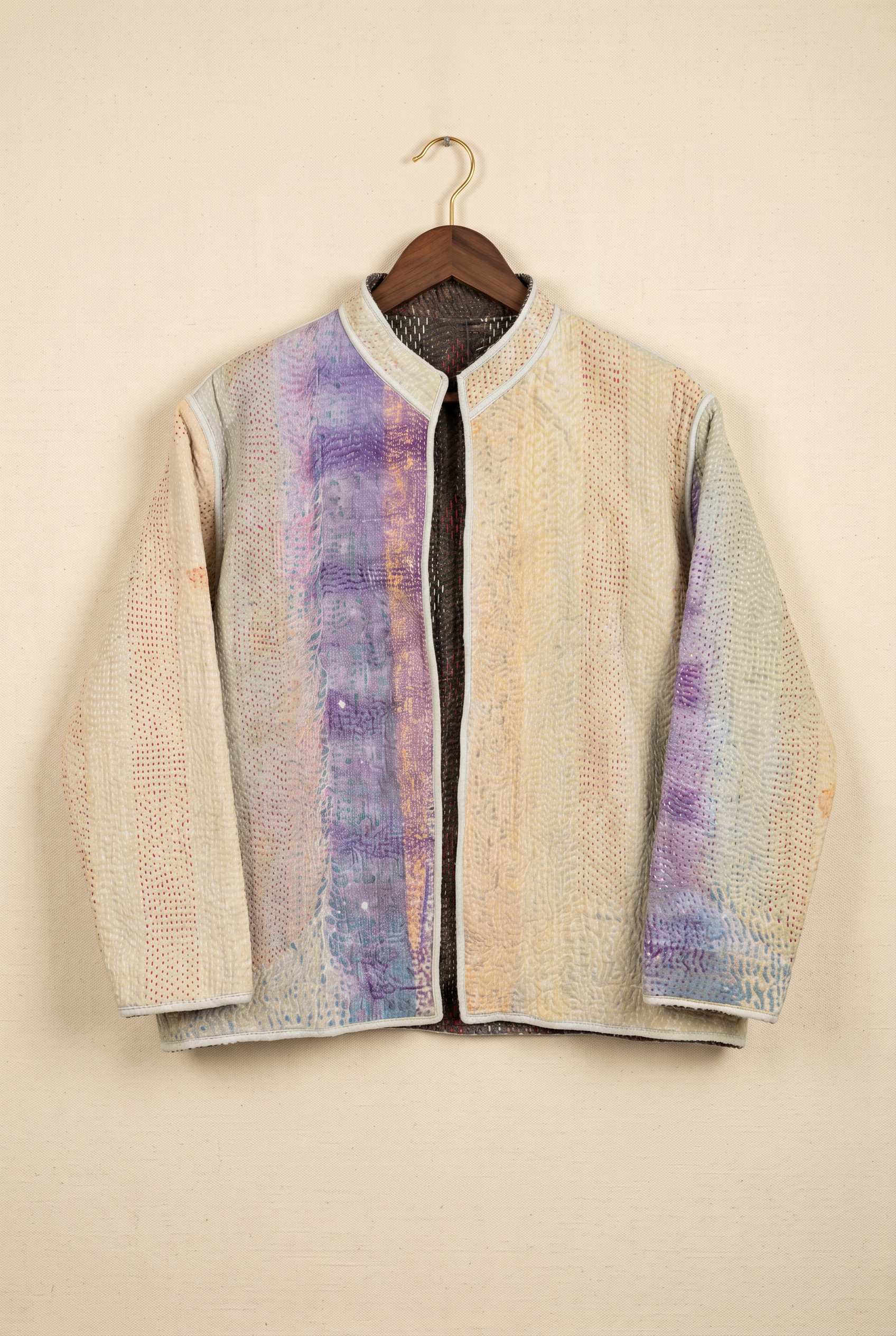 Pratima reversible kantha jacket — reverse side in natural cream with indigo panel on hanger