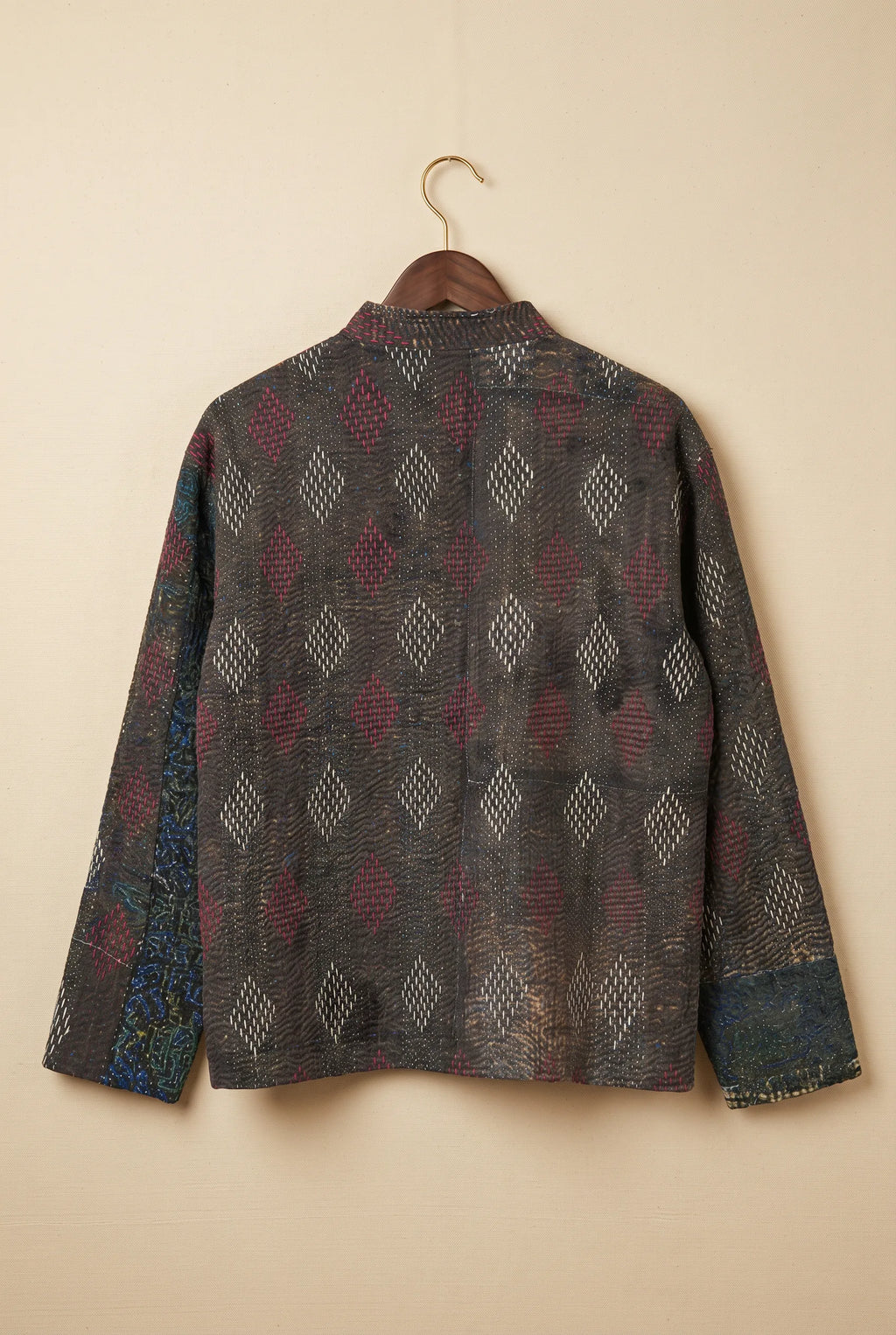 Pratima kantha jacket — back view showing diamond kantha embroidery on upcycled dark fabric