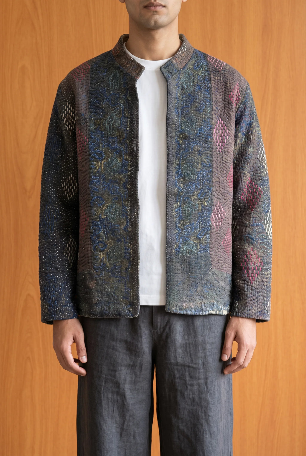 Model wearing Pratima kantha jacket closed — dark hand-embroidered upcycled Indian outerwear