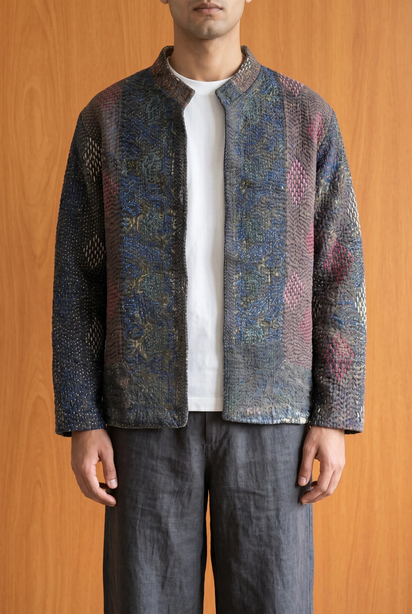 Model wearing Pratima kantha jacket closed — dark hand-embroidered upcycled Indian outerwear