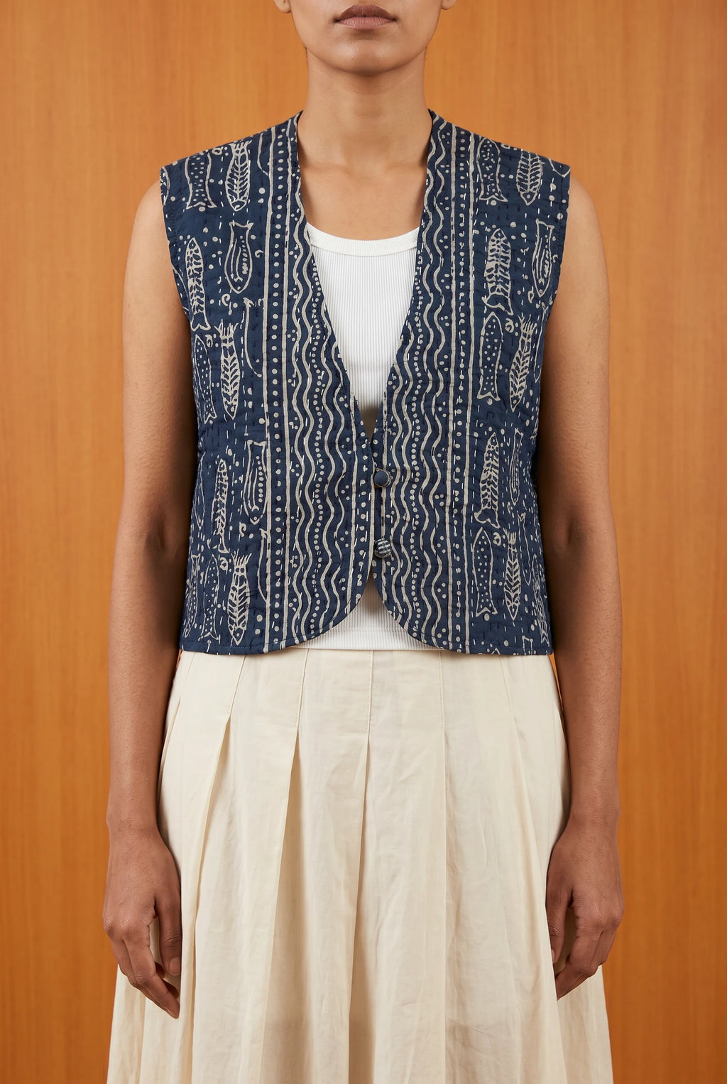 Model wearing Pratima reversible kantha vest over white top — sustainable Indian layering piece