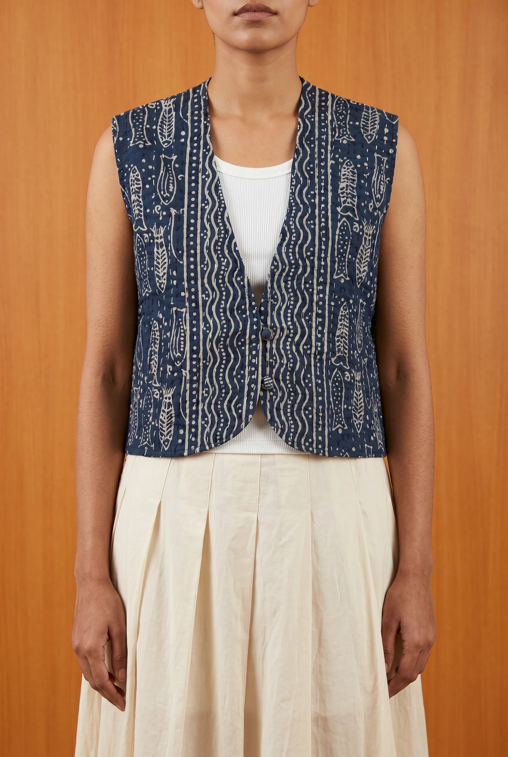 Model wearing Pratima reversible kantha vest over white top — sustainable Indian layering piece