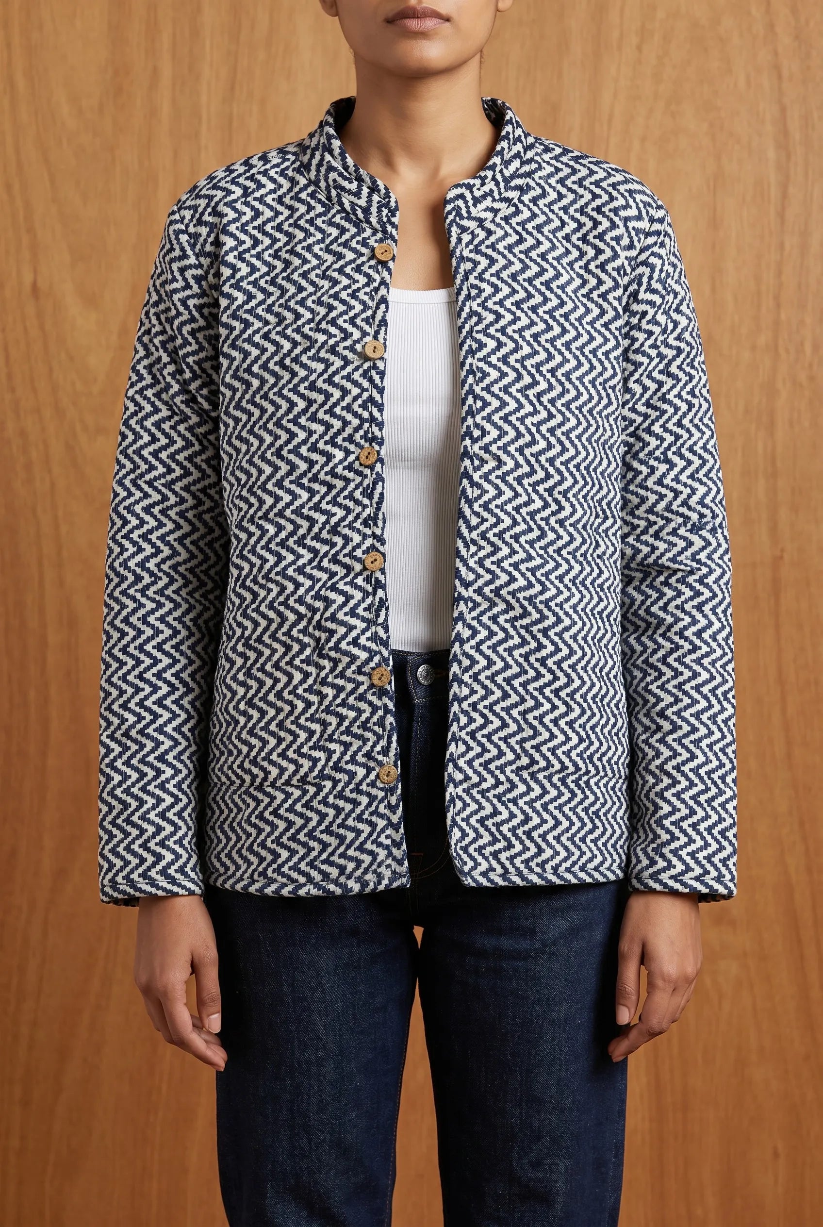 Model wearing Chhipa reversible jacket on zigzag reverse side — hand block-printed Indian cotton