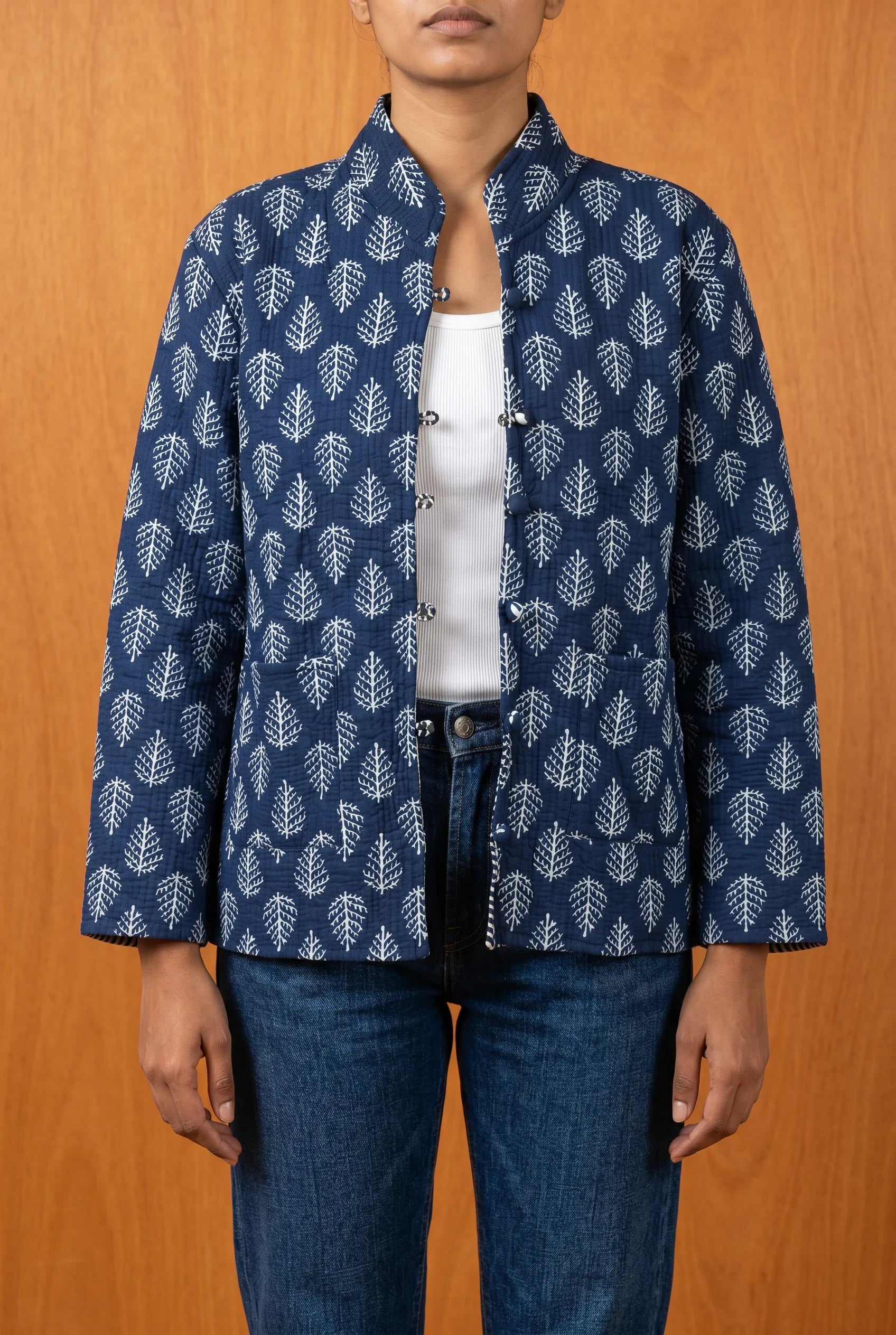 Model wearing Chhipa hand block-printed quilted jacket open — sustainable Indian outerwear