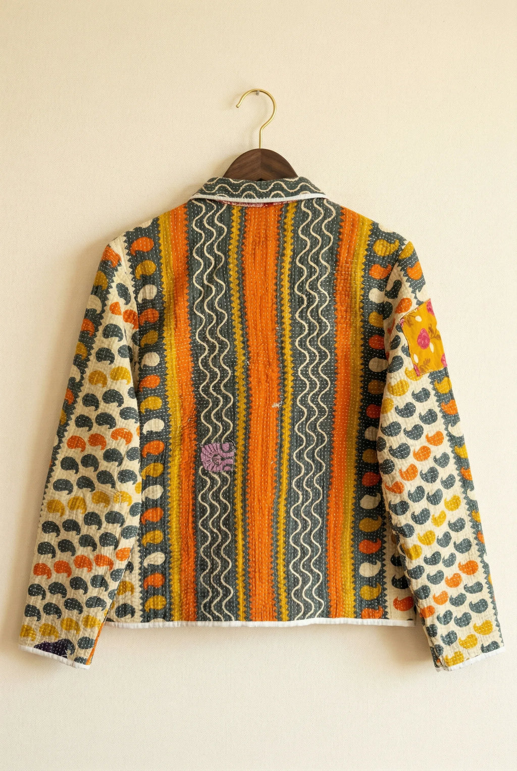 Kazi kantha jacket — back view of orange folk side, densely embroidered upcycled vintage fabric