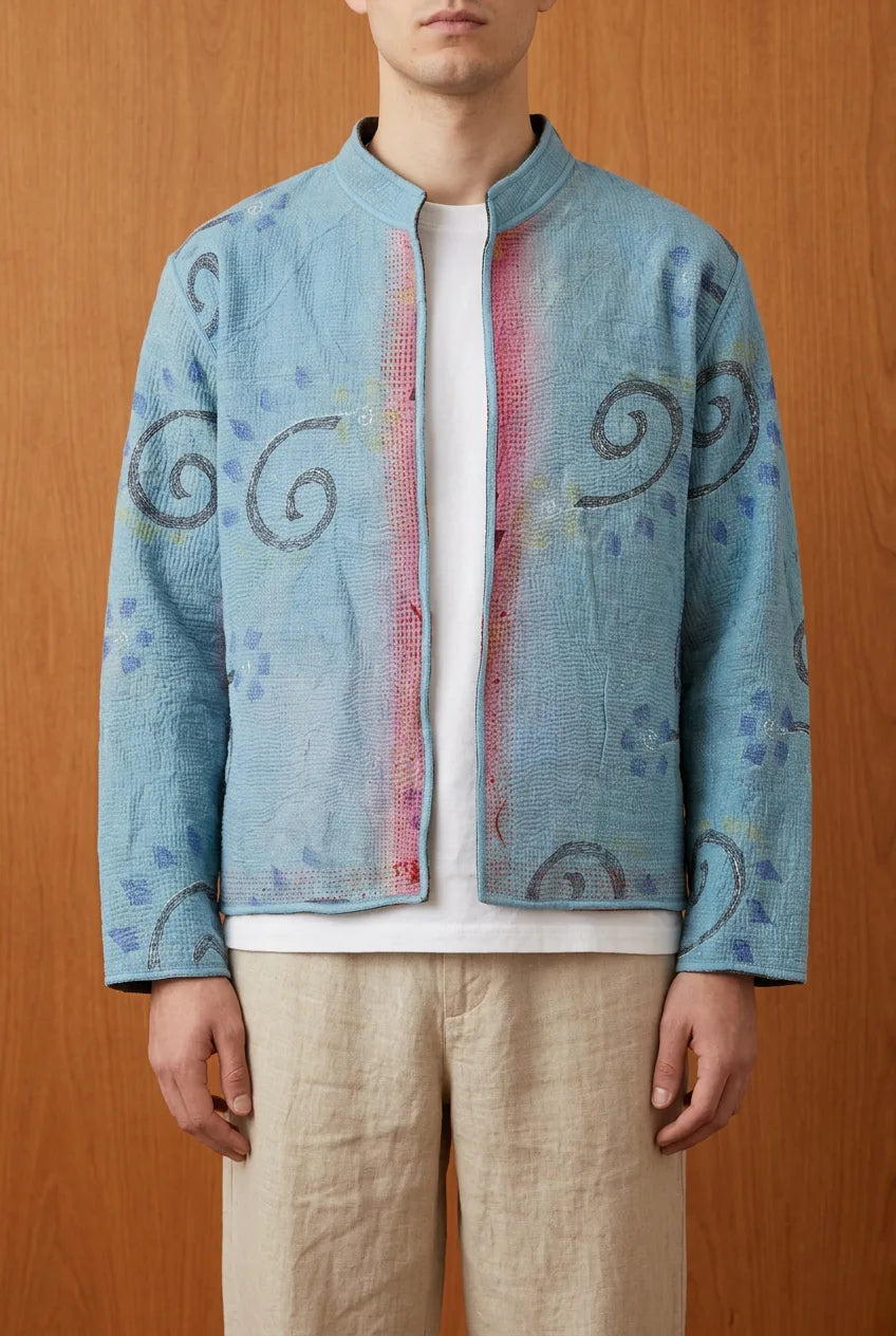 Model wearing Pratima Indigo kantha jacket open — blue hand-embroidered upcycled outerwear
