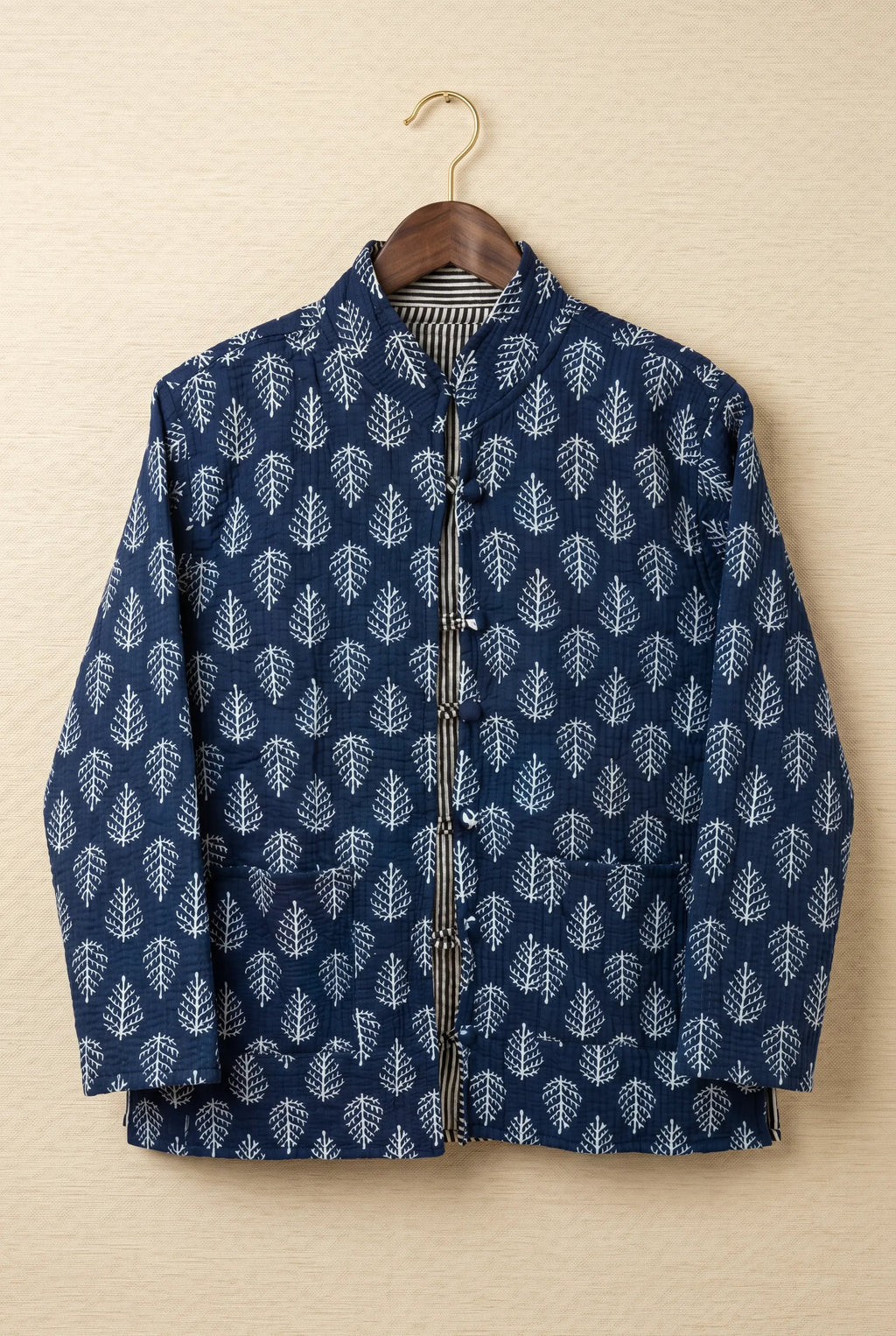 Chhipa quilted jacket — front view, hand block-printed navy leaf pattern on Indian cotton