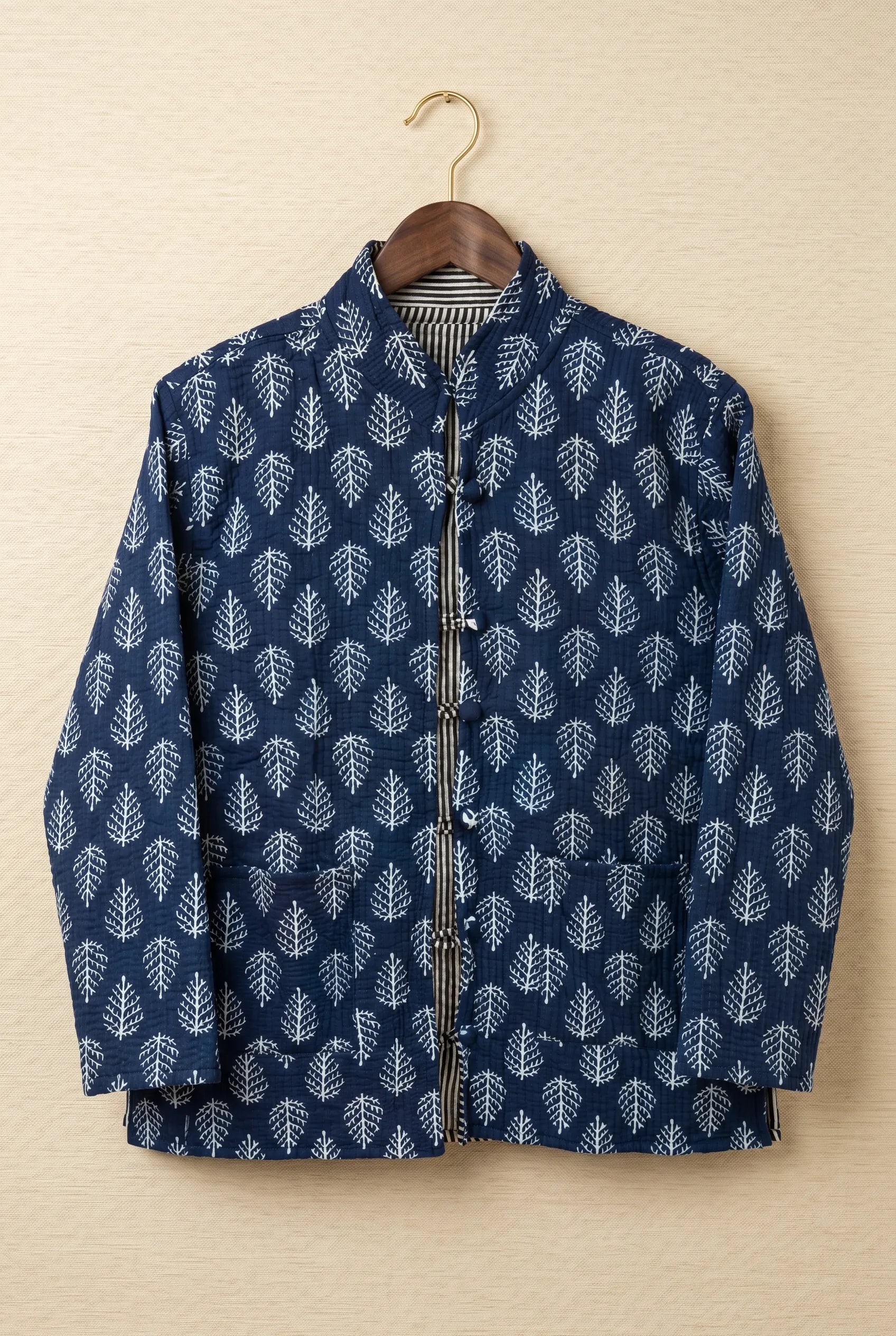 Chhipa quilted jacket — front view, hand block-printed navy leaf pattern on Indian cotton