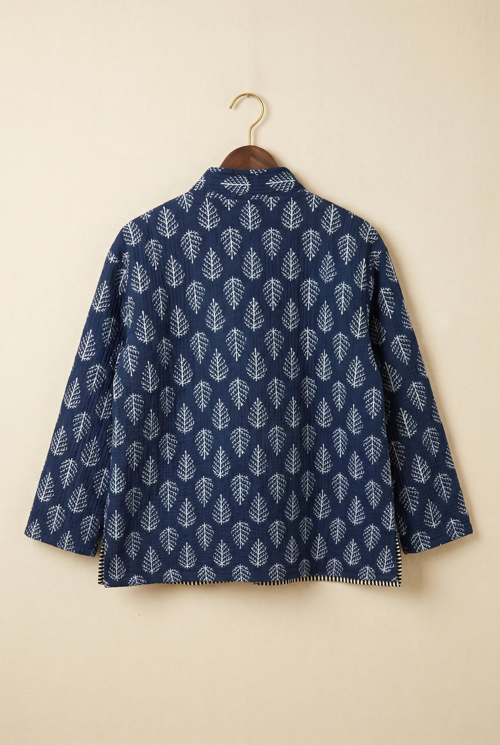 Chhipa quilted jacket — back view showing hand block-printed leaf pattern on Indian cotton