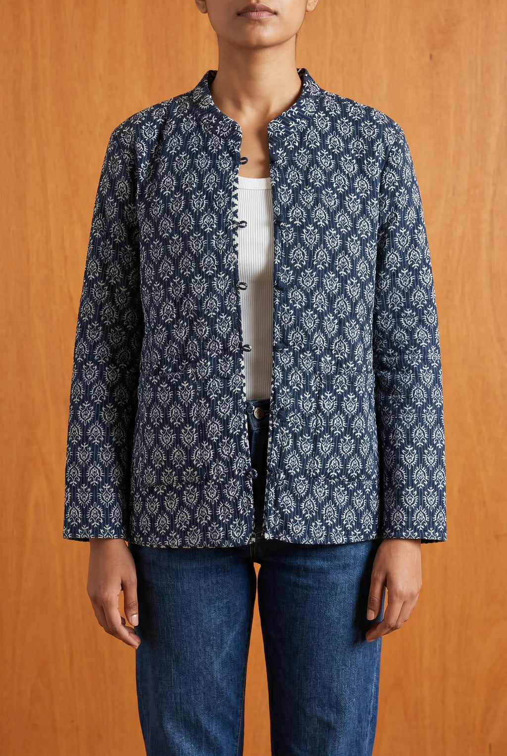 Model wearing Chhipa reversible jacket open — blue block-printed kantha-stitched Indian cotton