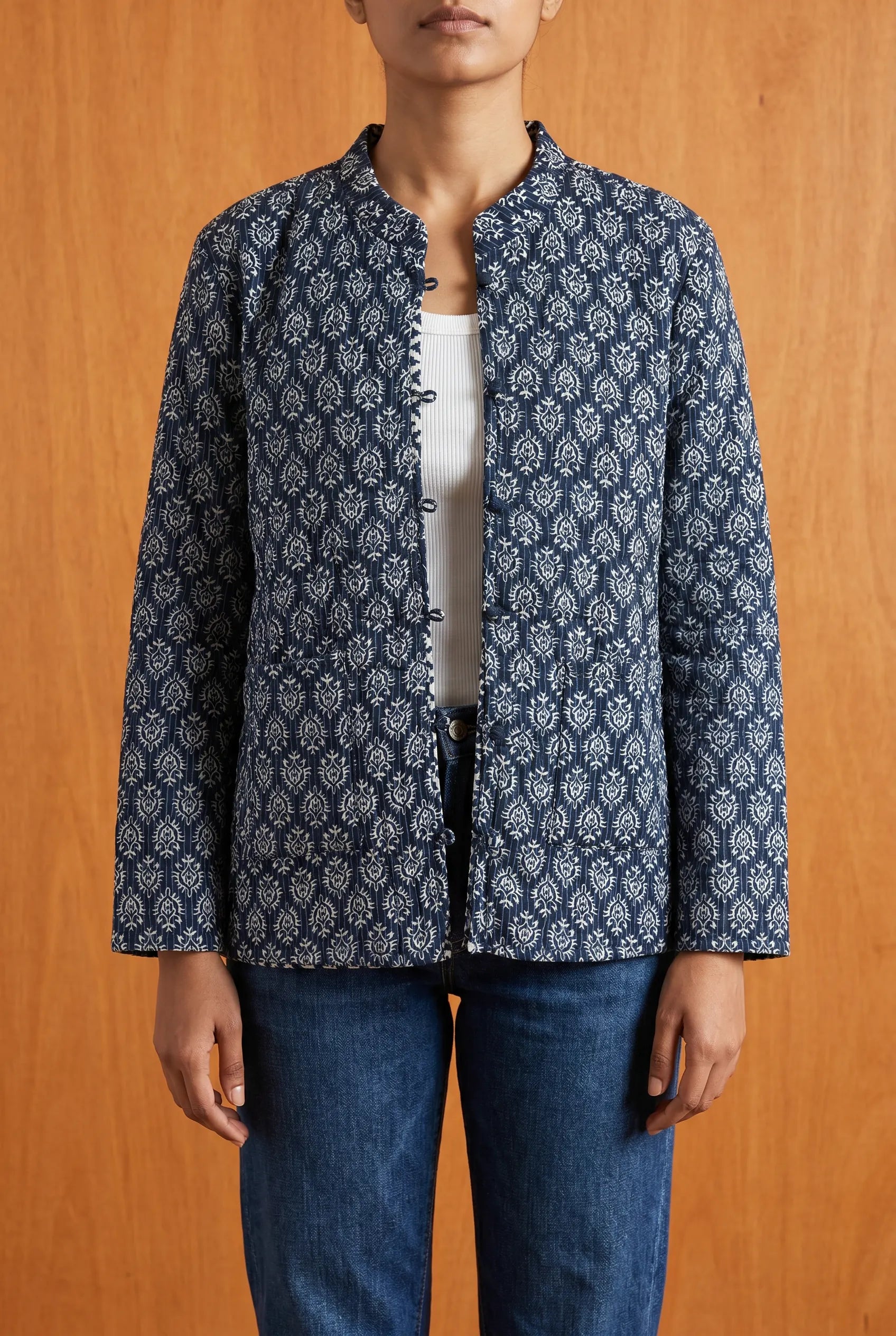 Model wearing Chhipa reversible jacket open — blue block-printed kantha-stitched Indian cotton